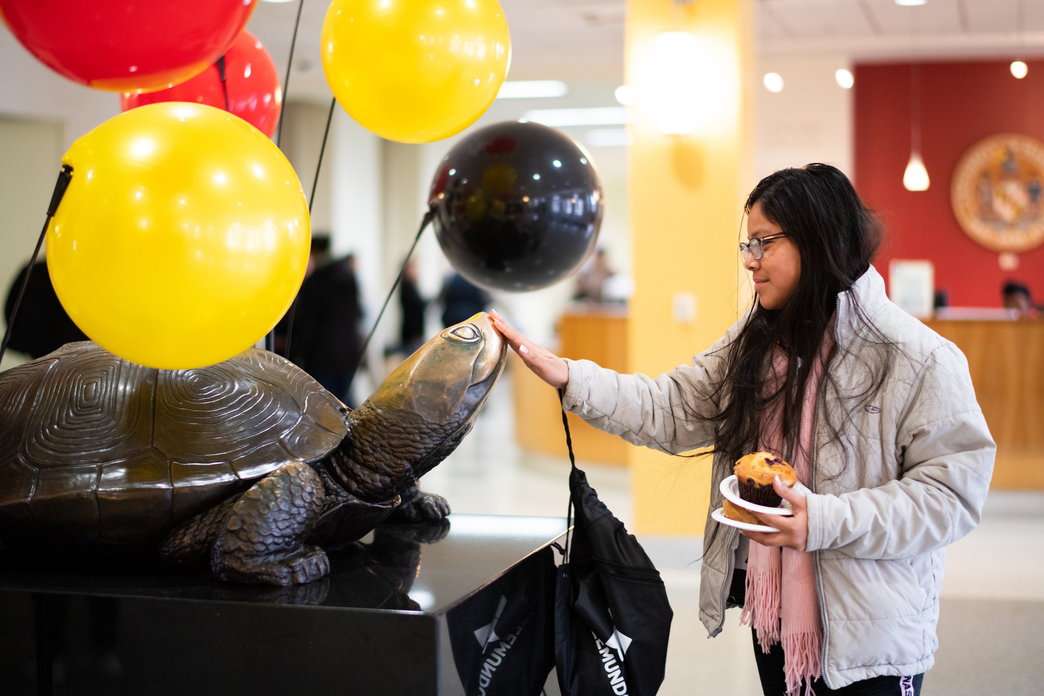 girl touching testudo