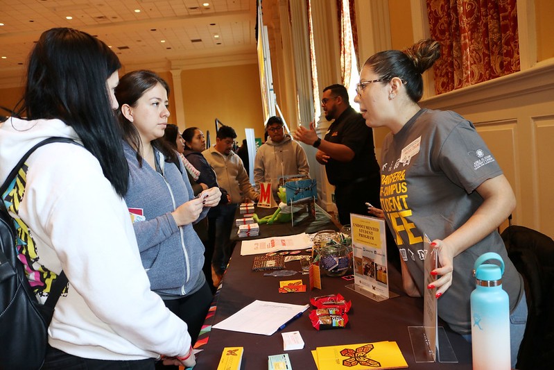 students and professionals talking