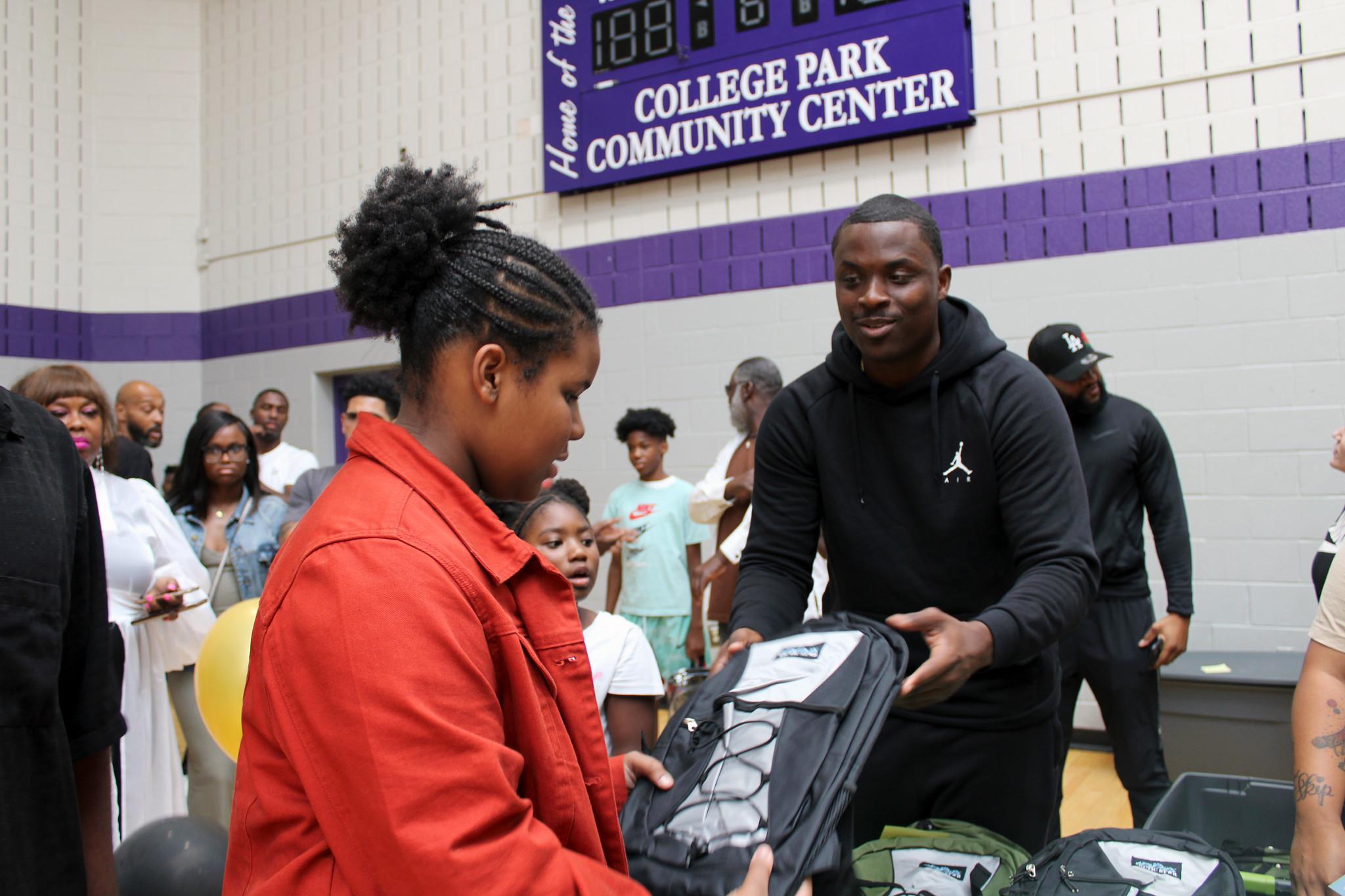 Chris Matthews gives away school supplies at College Park Community Center