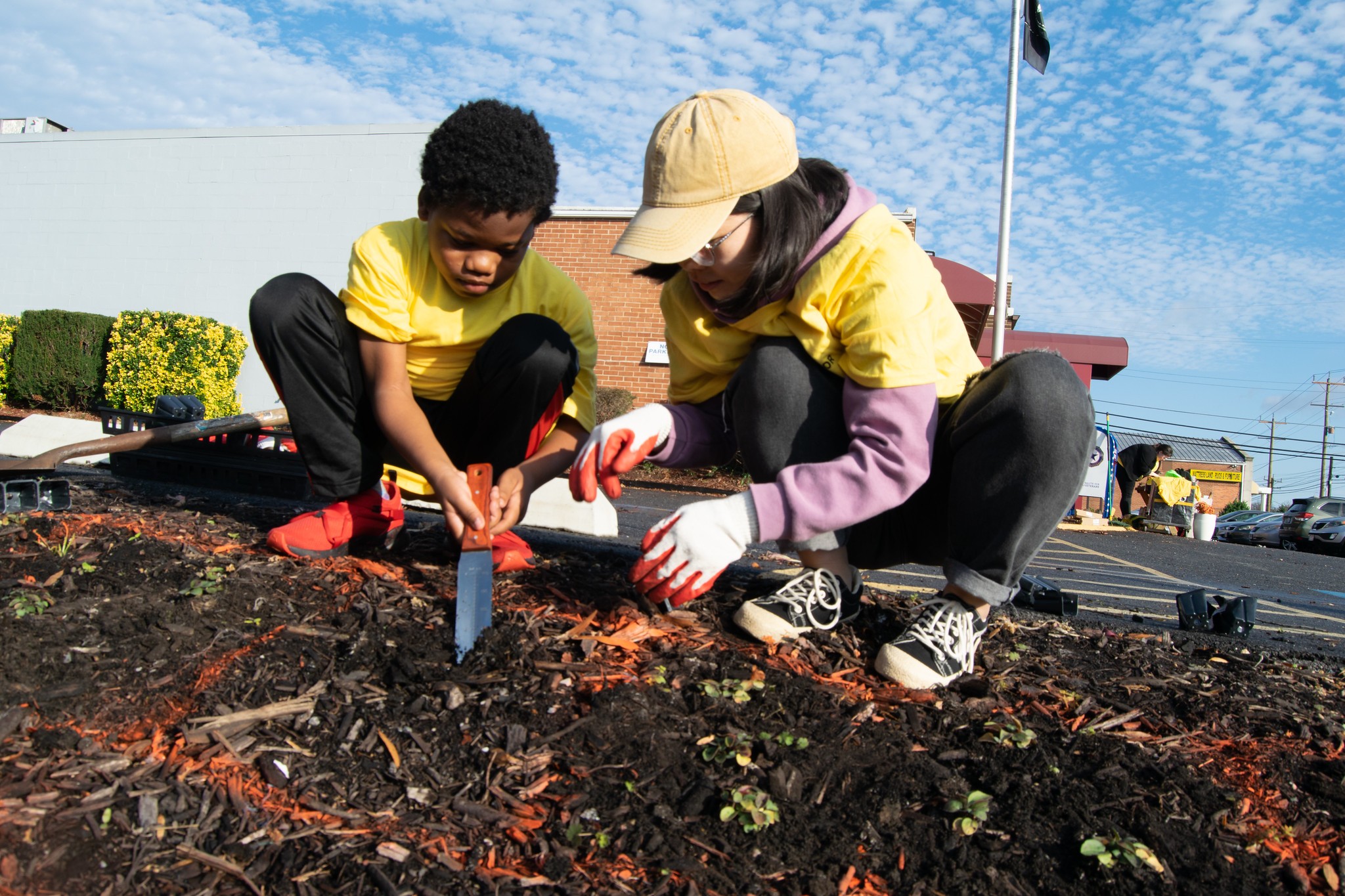 student and child digging