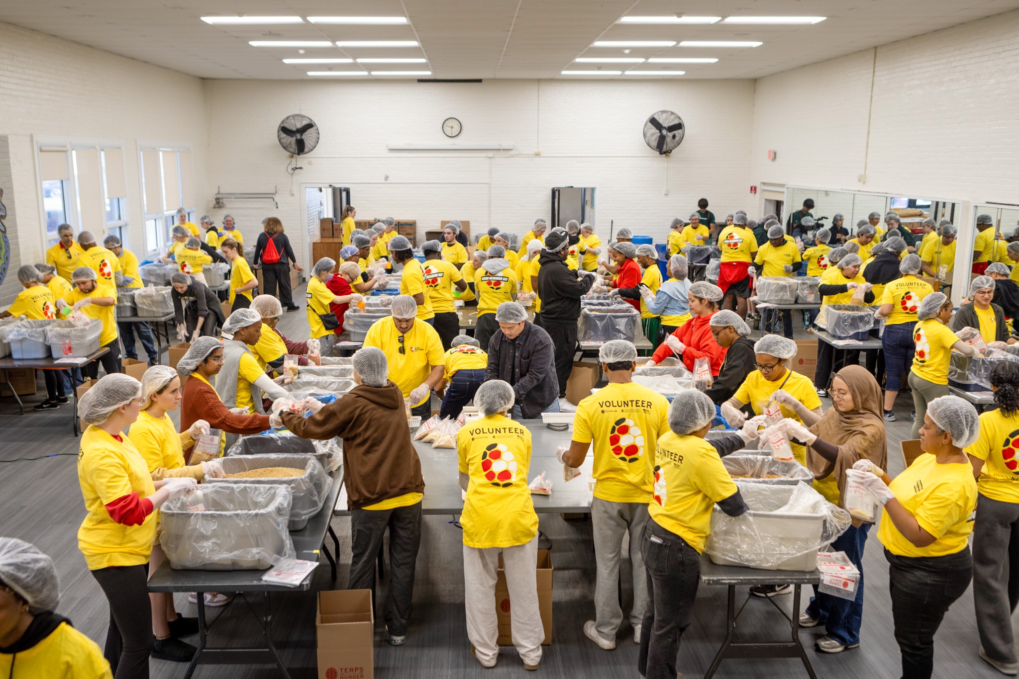 Terps pack food at Langley Park Community Center